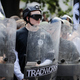 White supremacists, including one carrying a shield with the label of the now-defunct Traditionalist Workers Party, at Charlottesville in 2017.